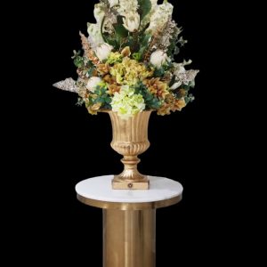 “Amazing Grace” arrangement epitomizes this philosophy, featuring a harmonious mix of protea, roses, geraniums, calla lilies, and various luxury greenery, all accented with gold leaves. Nestled in a glamorous Victorian-style vase handpainted in rustic gold, “Amazing Grace” exudes sophistication and luxury, making it a standout piece in any home or venue.