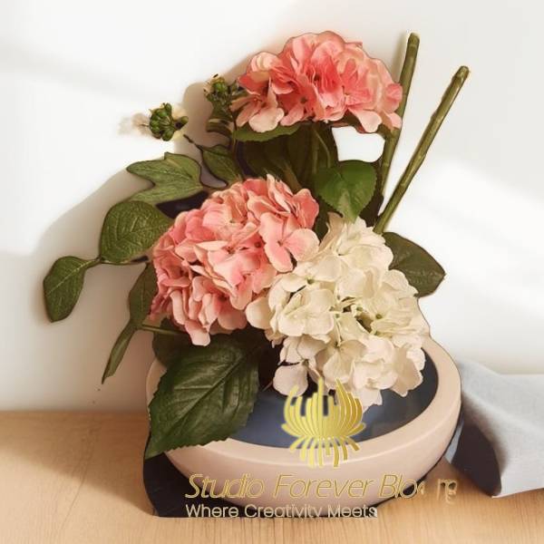 Elegant silk flower arrangement featuring hydrangeas in a sleek container by Studio Forever Bloom. Ideal for adding a touch of sophistication to any space Hello Hydrangea Silk Flower Arrangement by Studio Forever Bloom