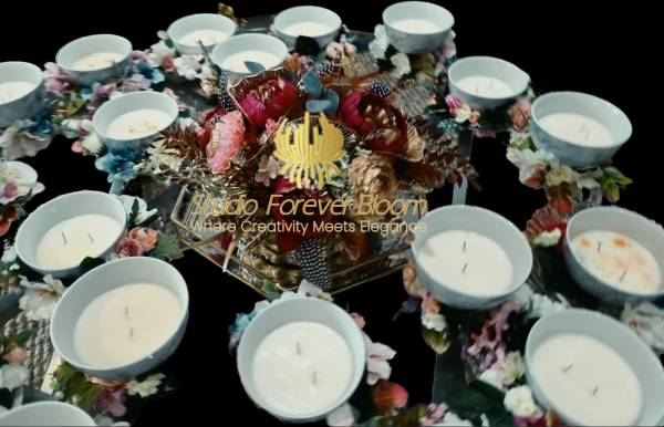 customizable Aromatic Garden hand poured soy candle with silk floral crown placed on a modern kitchen table