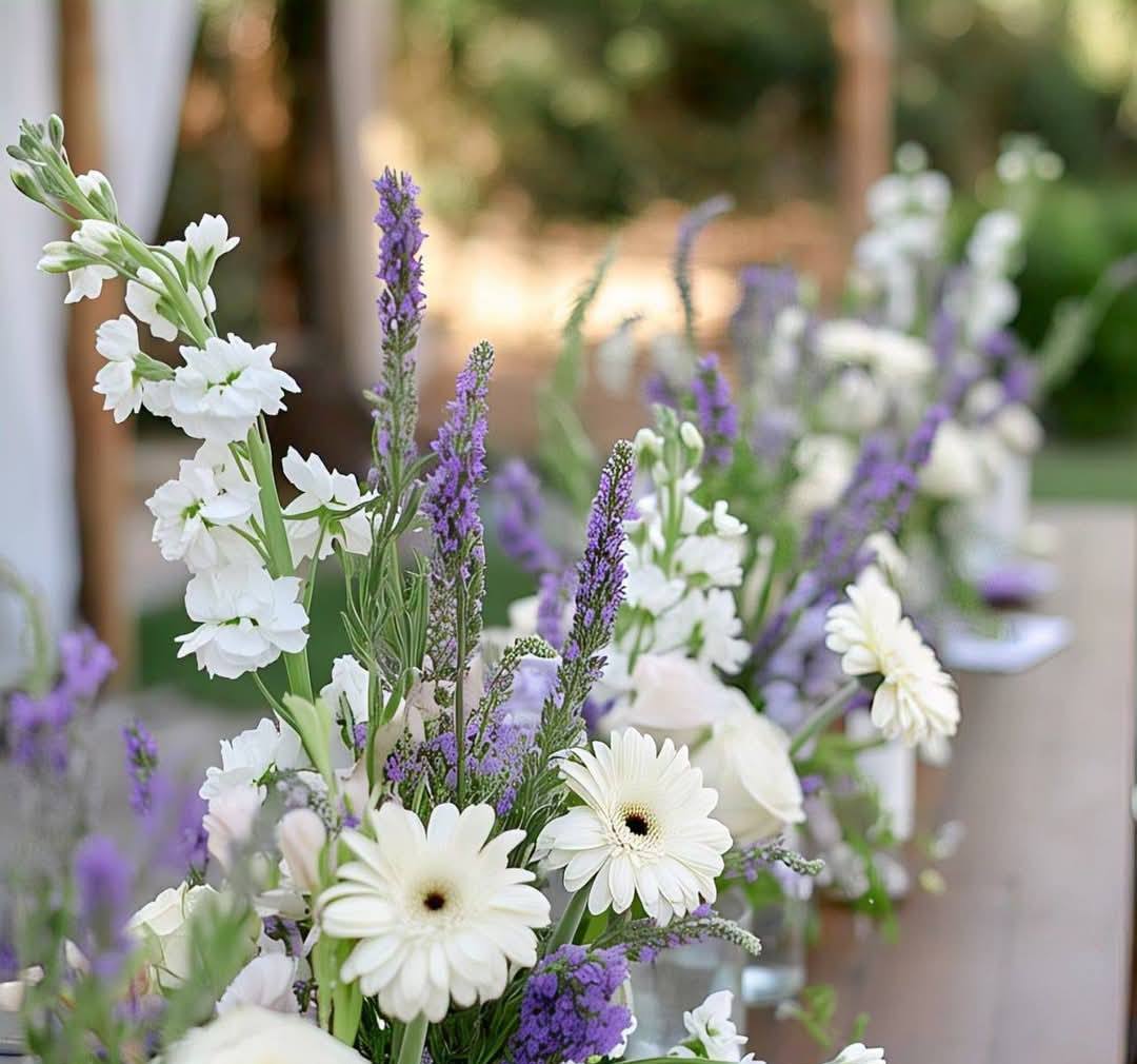 Lavender and purple silk flower centerpiece with white candles for a Melbourne backyard wedding 1 (3) Lavender and purple silk flower centerpiece with white candles for a Melbourne backyard wedding