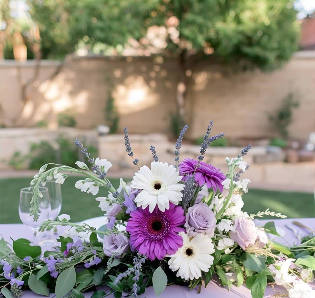 Lavender and purple silk flower centerpiece with white candles for a Melbourne backyard wedding 1 (4) Lavender and purple silk flower centerpiece with white candles for a Melbourne backyard wedding
