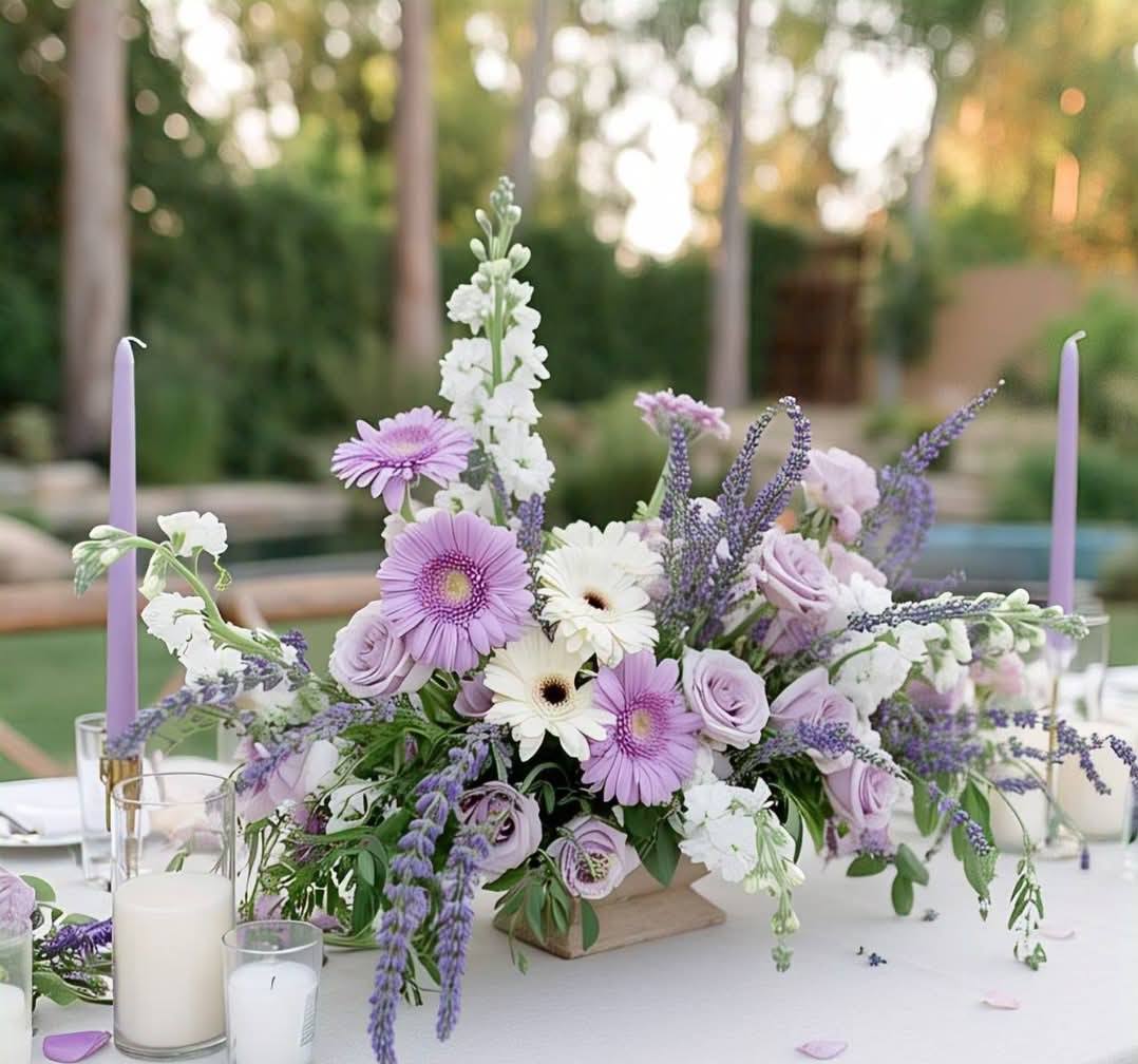 Lavender and purple silk flower centerpiece with white candles for a Melbourne backyard wedding 1 (5) Lavender and purple silk flower centerpiece with white candles for a Melbourne backyard wedding