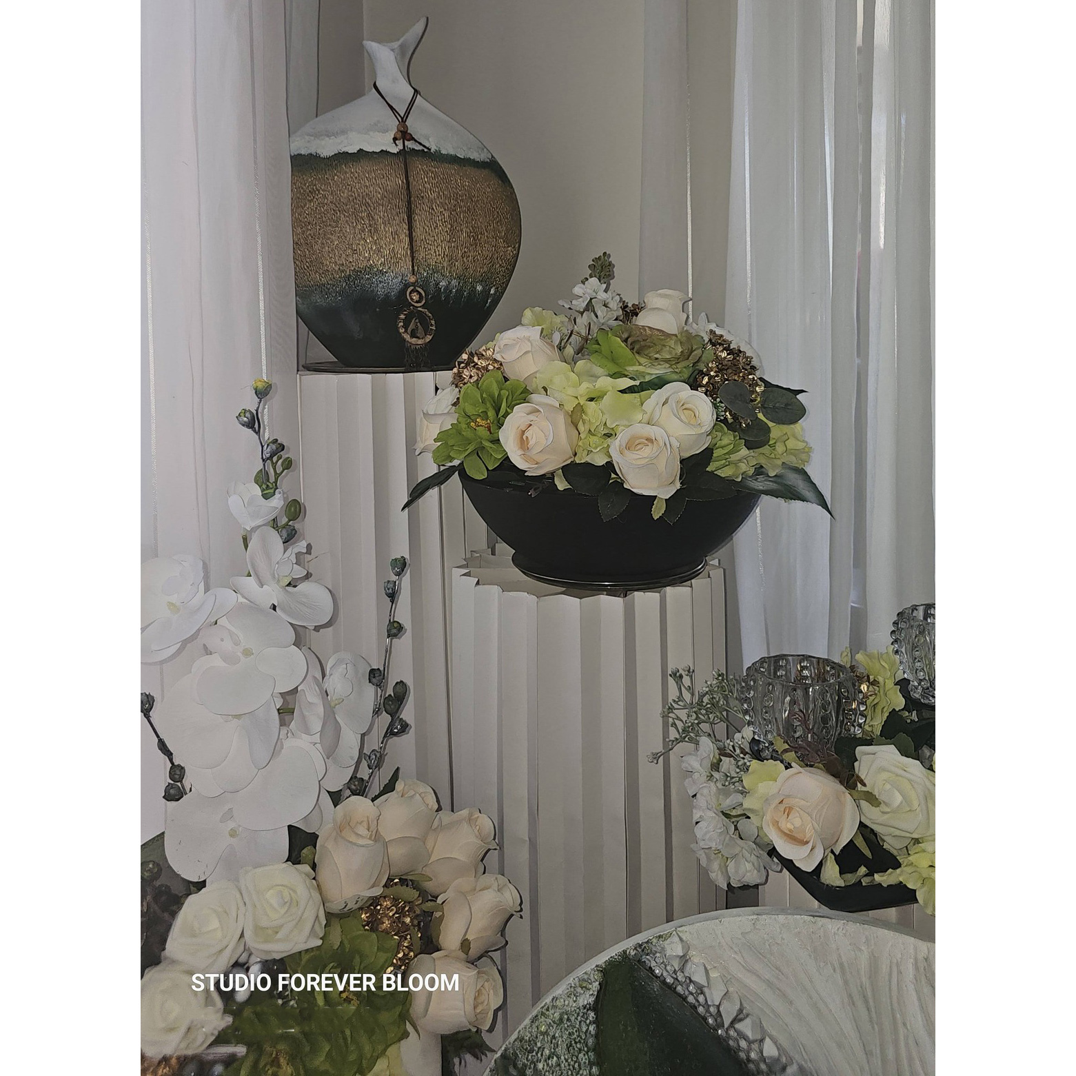 Luxury Gold Arch & Fluted Plinth Floral Set featuring handmade peach lilies, ivory silk roses, and white ribbed pedestals by Studio Forever Bloom.