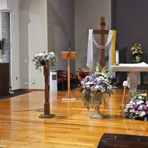 Church Wedding Flowers Melbourne Large gold urn with purple, pink, and white floral arrangement featuring eucalyptus for a church wedding.