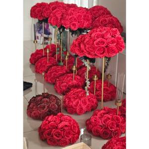 Luxurious red silk floral centerpieces with gold stands and candle holders for a Melbourne wedding by Studio Forever Bloom.